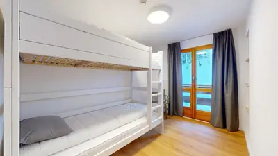 Ein Bett oder Betten in einem Zimmer der Unterkunft Chalet de l Ours AUTHENTIC Etage Tournay 12 pers