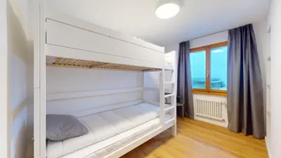 Ein Bett oder Betten in einem Zimmer der Unterkunft Chalet de l Ours AUTHENTIC Etage Valerie 12 pers