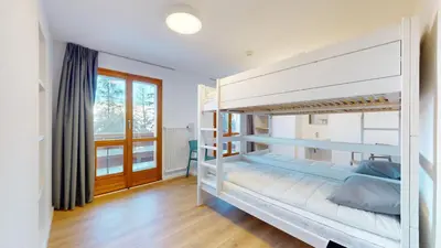 Ein Bett oder Betten in einem Zimmer der Unterkunft Chalet de l Ours AUTHENTIC Etage Fontaine 14 pers