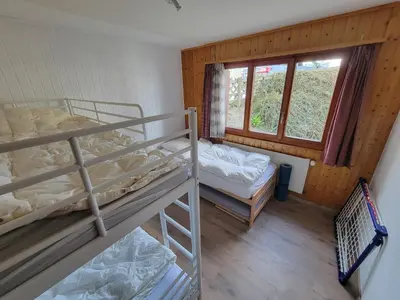 Ein Bett oder Betten in einem Zimmer der Unterkunft Vacances à la montagne