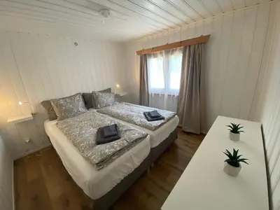 Ein Bett oder Betten in einem Zimmer der Unterkunft Cozy 2-Bedroom Bungalow