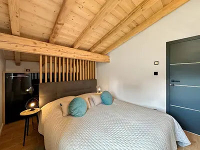 Ein Bett oder Betten in einem Zimmer der Unterkunft Dynastic Penthouse - 4 Valleys - Swiss Alps