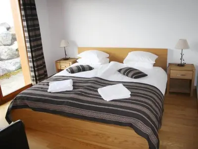 Ein Bett oder Betten in einem Zimmer der Unterkunft Apartment Nubes- Chalet by Interhome