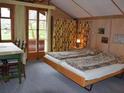 Ein Bett oder Betten in einem Zimmer der Unterkunft Apartment Chalet Maru by Interhome