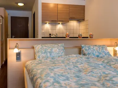 Ein Bett oder Betten in einem Zimmer der Unterkunft Apartment Amici-2 by Interhome