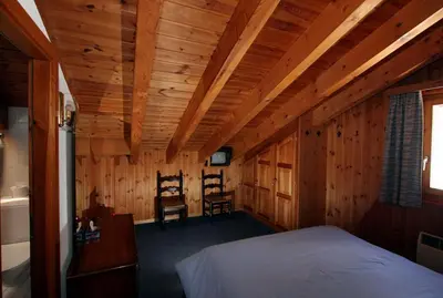 Ein Bett oder Betten in einem Zimmer der Unterkunft Hôtel Garni Les Bouquetins
