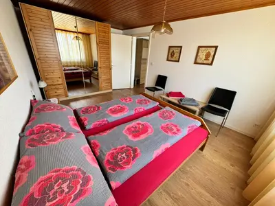 Ein Bett oder Betten in einem Zimmer der Unterkunft Rosenhaus Baccara