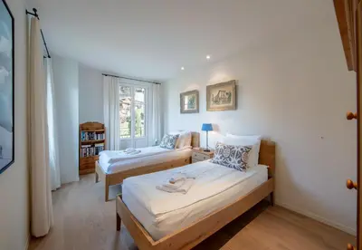 Ein Bett oder Betten in einem Zimmer der Unterkunft Chalet Mittaghorn Apt 4
