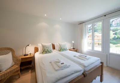 Ein Bett oder Betten in einem Zimmer der Unterkunft Chalet Mittaghorn Apt 4