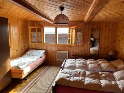 Ein Bett oder Betten in einem Zimmer der Unterkunft Chalet 3 pièces de caractère