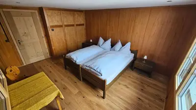 Ein Bett oder Betten in einem Zimmer der Unterkunft Chalet Bärgsunne