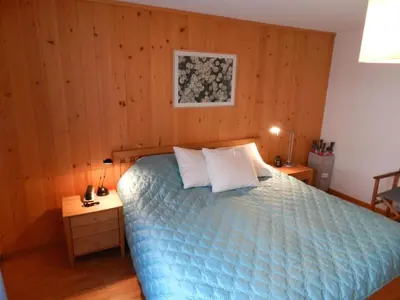 Ein Bett oder Betten in einem Zimmer der Unterkunft Apartment Hübeli - Chapman by Interhome