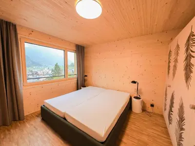 Ein Bett oder Betten in einem Zimmer der Unterkunft Apartment Brunnhorn EG Nordost by Interhome