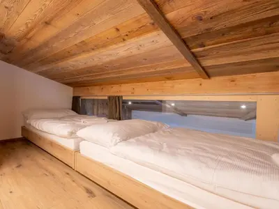 Ein Bett oder Betten in einem Zimmer der Unterkunft Apartment Haus Alpenrose by Interhome