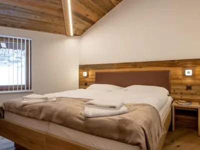 Ein Bett oder Betten in einem Zimmer der Unterkunft Apartment Haus Alpenrose by Interhome