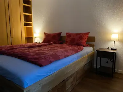 Ein Bett oder Betten in einem Zimmer der Unterkunft Ferienwohnung Alpen-Zauber Leukerbad