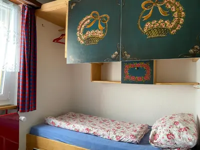 Ein Bett oder Betten in einem Zimmer der Unterkunft Ferienwohnung Alpen-Zauber Leukerbad