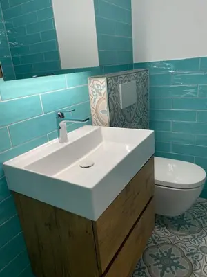 Ein Badezimmer in der Unterkunft Ferienwohnung Alpen-Zauber Leukerbad