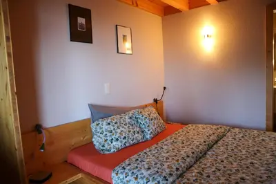 Ein Bett oder Betten in einem Zimmer der Unterkunft Chalet Tzarbonire