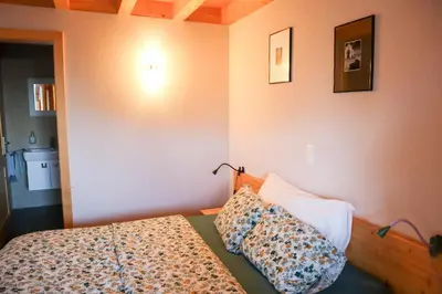 Ein Bett oder Betten in einem Zimmer der Unterkunft Chalet Tzarbonire