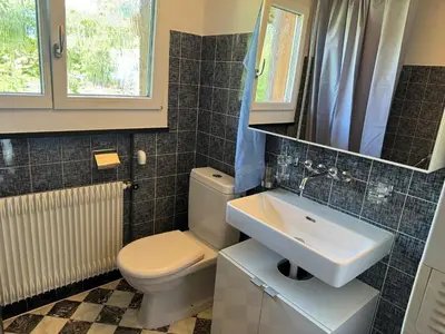 Ein Badezimmer in der Unterkunft See und Berge Loft