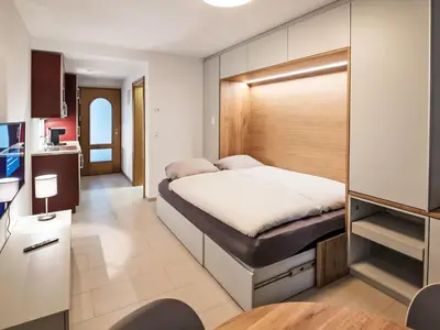 Ein Bett oder Betten in einem Zimmer der Unterkunft Apartment B01 by Interhome