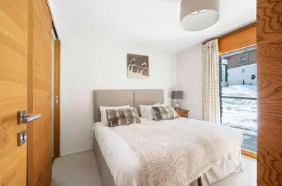 Ein Bett oder Betten in einem Zimmer der Unterkunft Sonnegg Lodge