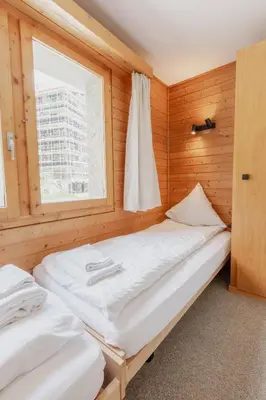 Ein Bett oder Betten in einem Zimmer der Unterkunft Charmant duplex à 3min des remontées mécaniques