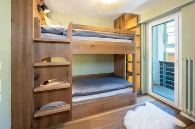 Ein Bett oder Betten in einem Zimmer der Unterkunft Haus Cervino - luxury apartment