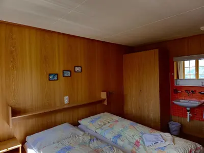 Ein Bett oder Betten in einem Zimmer der Unterkunft Berggasthaus Höchst