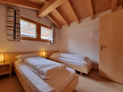 Ein Bett oder Betten in einem Zimmer der Unterkunft Snowfun B Penthouse