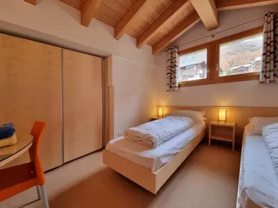 Ein Bett oder Betten in einem Zimmer der Unterkunft Snowfun B Penthouse