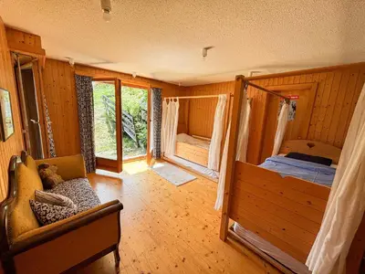 Ein Bett oder Betten in einem Zimmer der Unterkunft Chalet La Madelon - Idéal pour les grandes familles