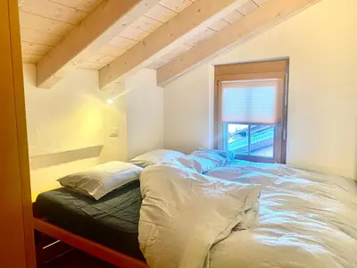 Ein Bett oder Betten in einem Zimmer der Unterkunft Heidahüs Penthouse