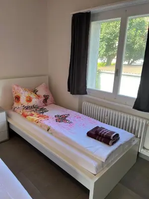 Ein Bett oder Betten in einem Zimmer der Unterkunft HANNA Apartment