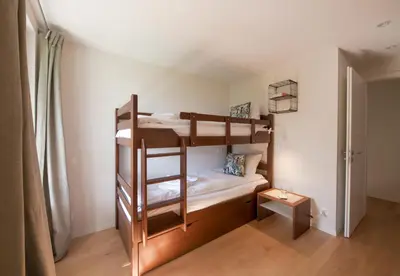 Ein Bett oder Betten in einem Zimmer der Unterkunft Chalet Mittaghorn Apt 5