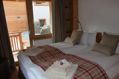 Ein Bett oder Betten in einem Zimmer der Unterkunft Chalet Binna