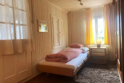 Ein Bett oder Betten in einem Zimmer der Unterkunft Wunderschönes Chalet Stöckli