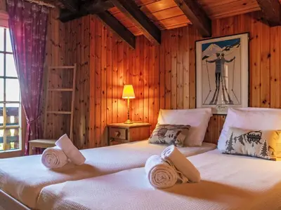 Ein Bett oder Betten in einem Zimmer der Unterkunft Chalet Mirabeau 6 by Interhome