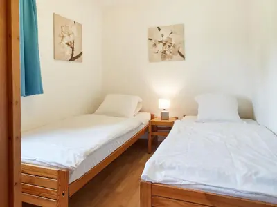 Ein Bett oder Betten in einem Zimmer der Unterkunft Chalet Lilas by Interhome