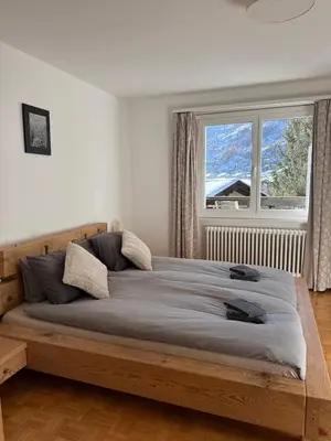 Ein Bett oder Betten in einem Zimmer der Unterkunft Apartment Snowball, Modern, cosy, Matterhorn views