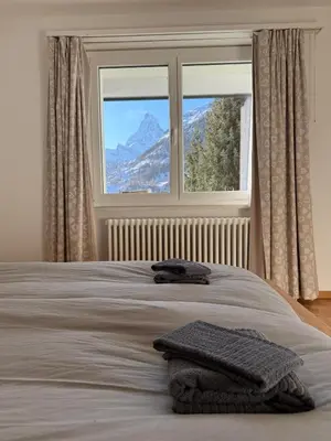 Ein Bett oder Betten in einem Zimmer der Unterkunft Apartment Snowball, Modern, cosy, Matterhorn views