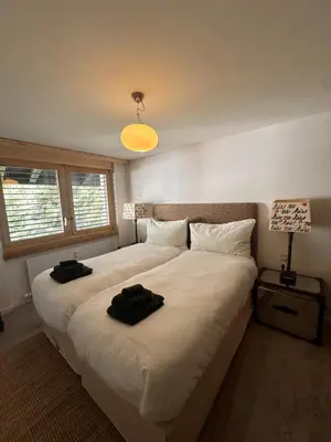 Ein Bett oder Betten in einem Zimmer der Unterkunft Turquino Loft - Duplex 4 Bedroom Chalet in Zermatt
