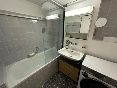 Ein Badezimmer in der Unterkunft Appartement central avec Spa