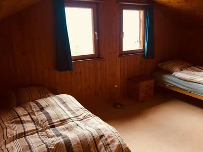 Ein Bett oder Betten in einem Zimmer der Unterkunft Chalet Lana in sonniger, ruhiger Lage