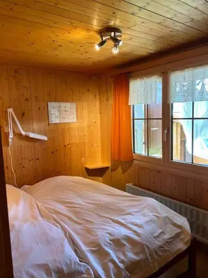 Ein Bett oder Betten in einem Zimmer der Unterkunft Chalet Glücksfall