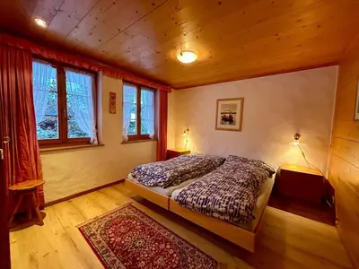 Ein Bett oder Betten in einem Zimmer der Unterkunft Gstaad Blue Sky Chalet