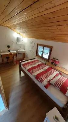 Ein Bett oder Betten in einem Zimmer der Unterkunft Auberge Restaurant les Aiguilles Rouges