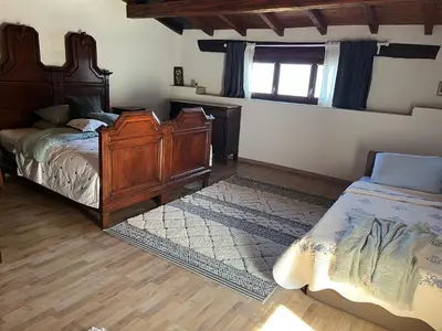 Ein Bett oder Betten in einem Zimmer der Unterkunft Rustico Corte