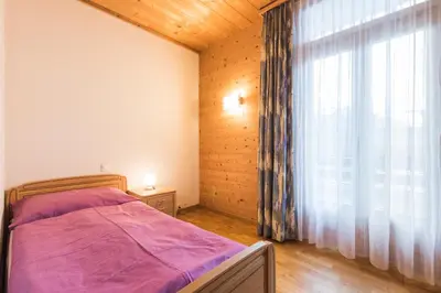 Ein Bett oder Betten in einem Zimmer der Unterkunft Hotel Alpenrose beim Ballenberg